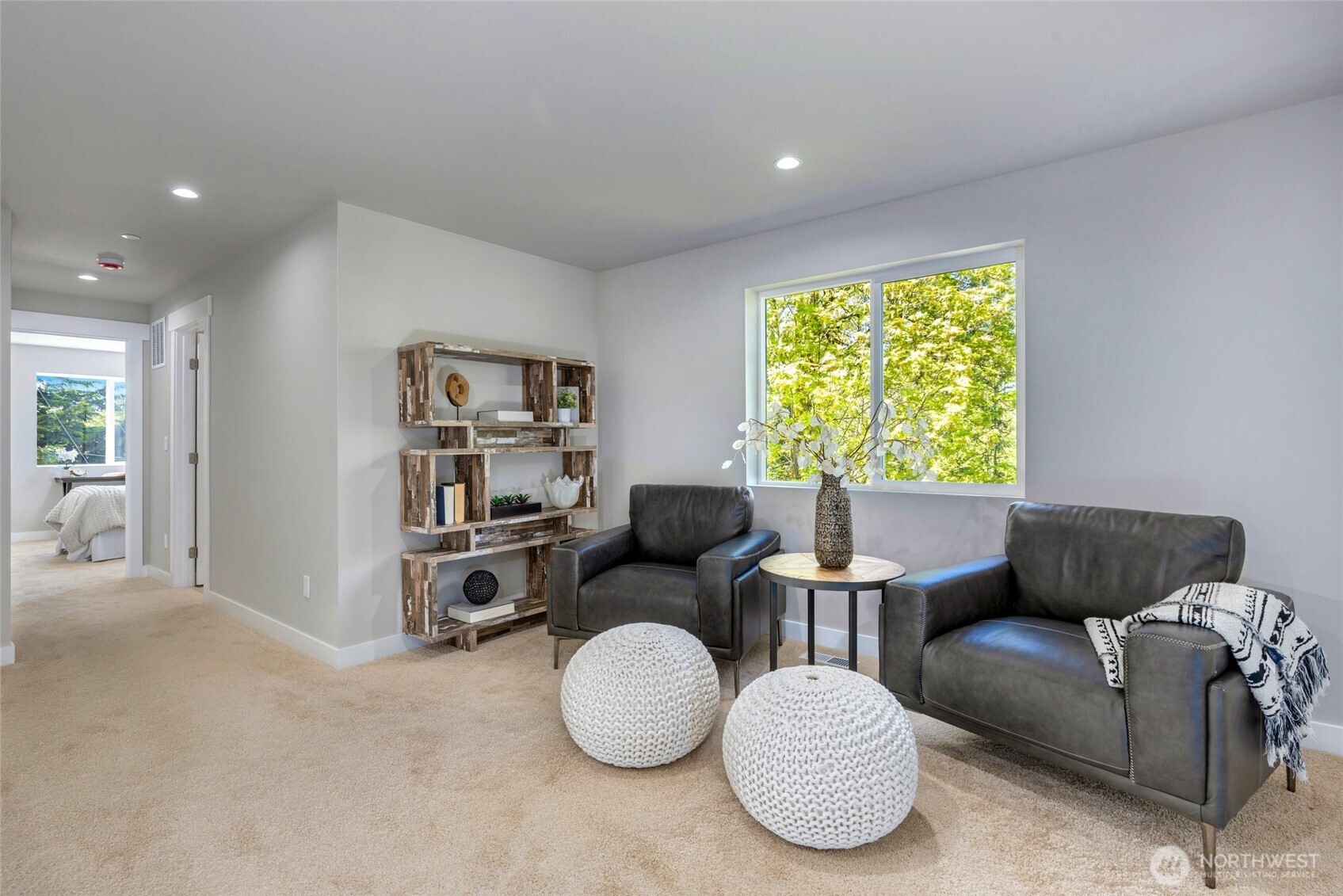 Loft space / second media room on the upper level of home.