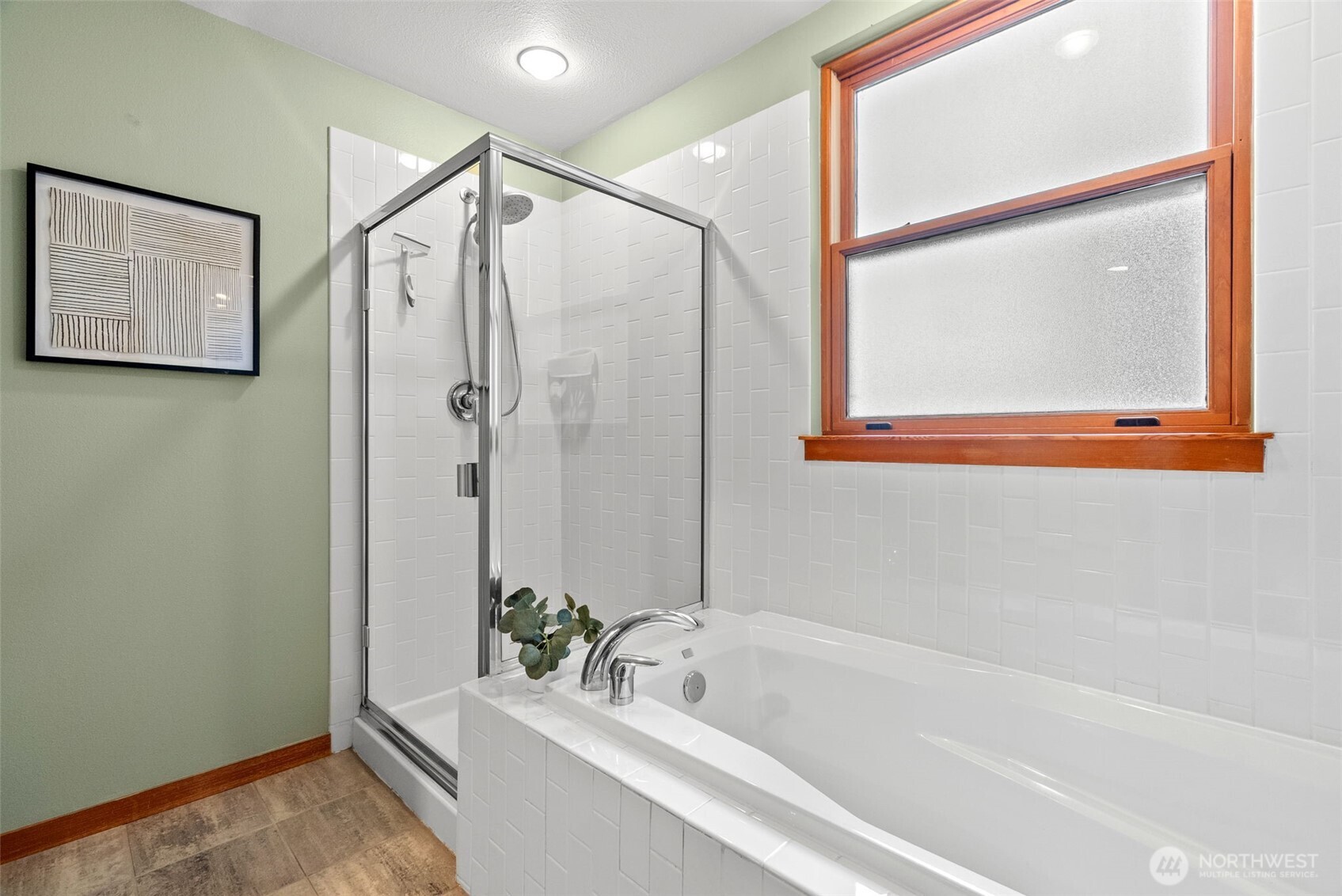 Room for seating area in primary suite, the perfect area to cozy up with a book and enjoy the views