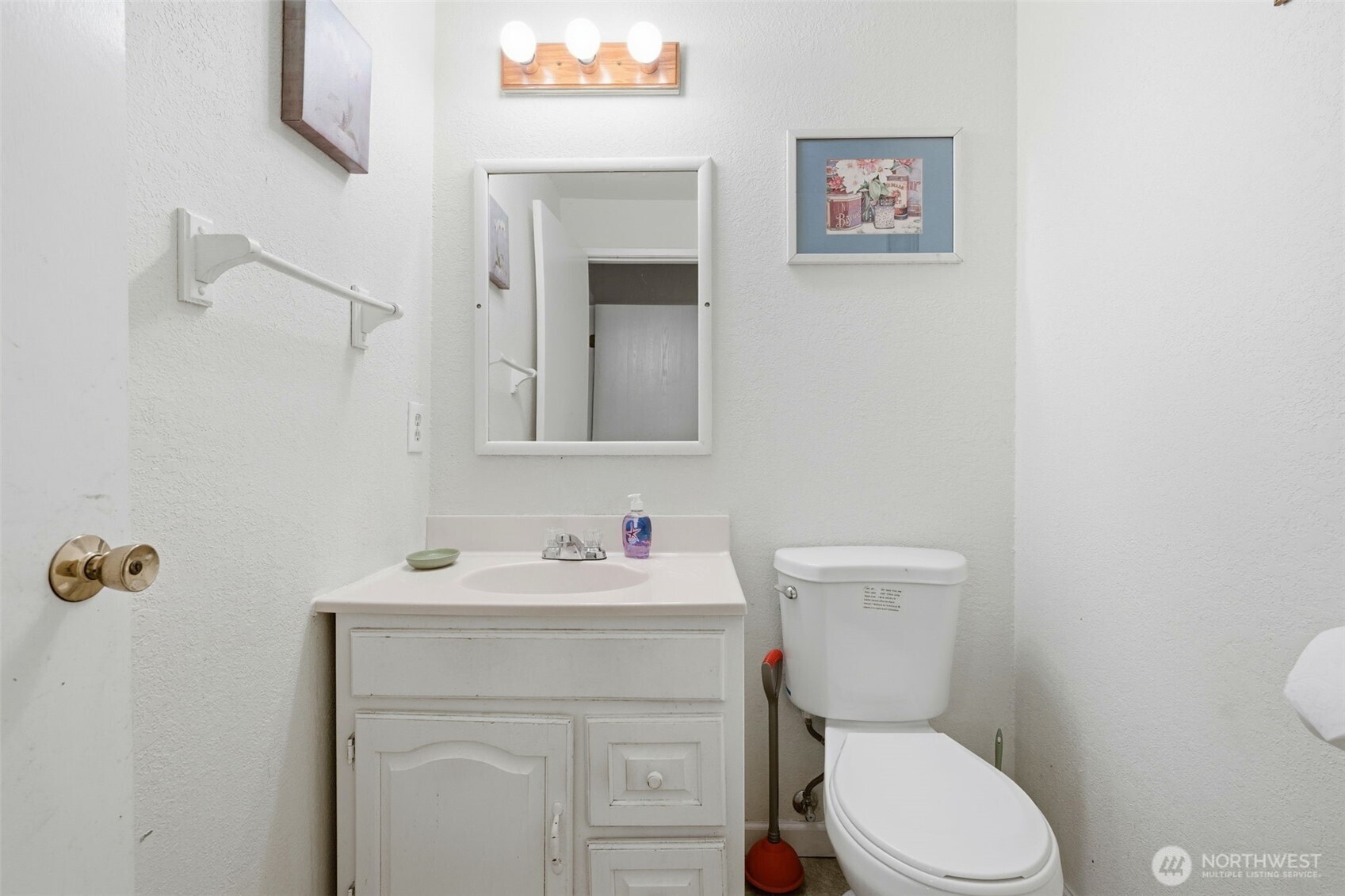 Downstairs 1/2 bathroom down the hall from the recreation room!