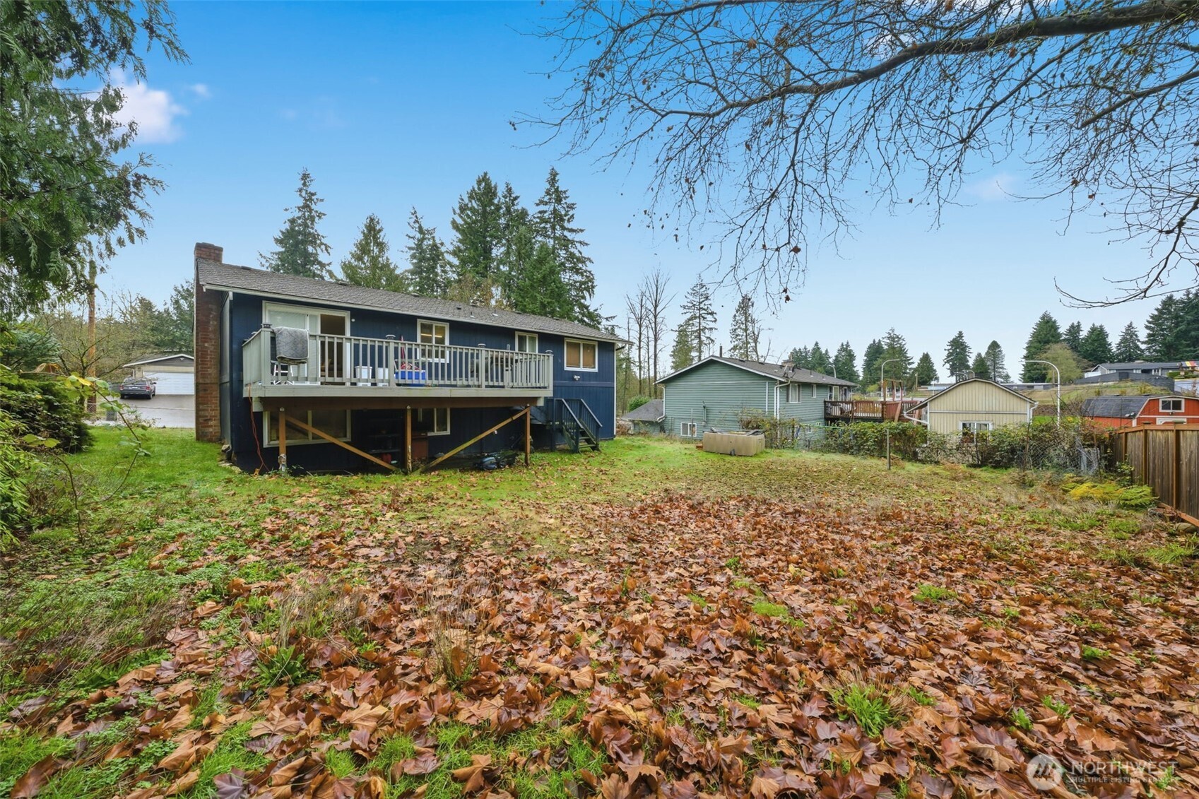 View of the huge backyard, the deck and patio!