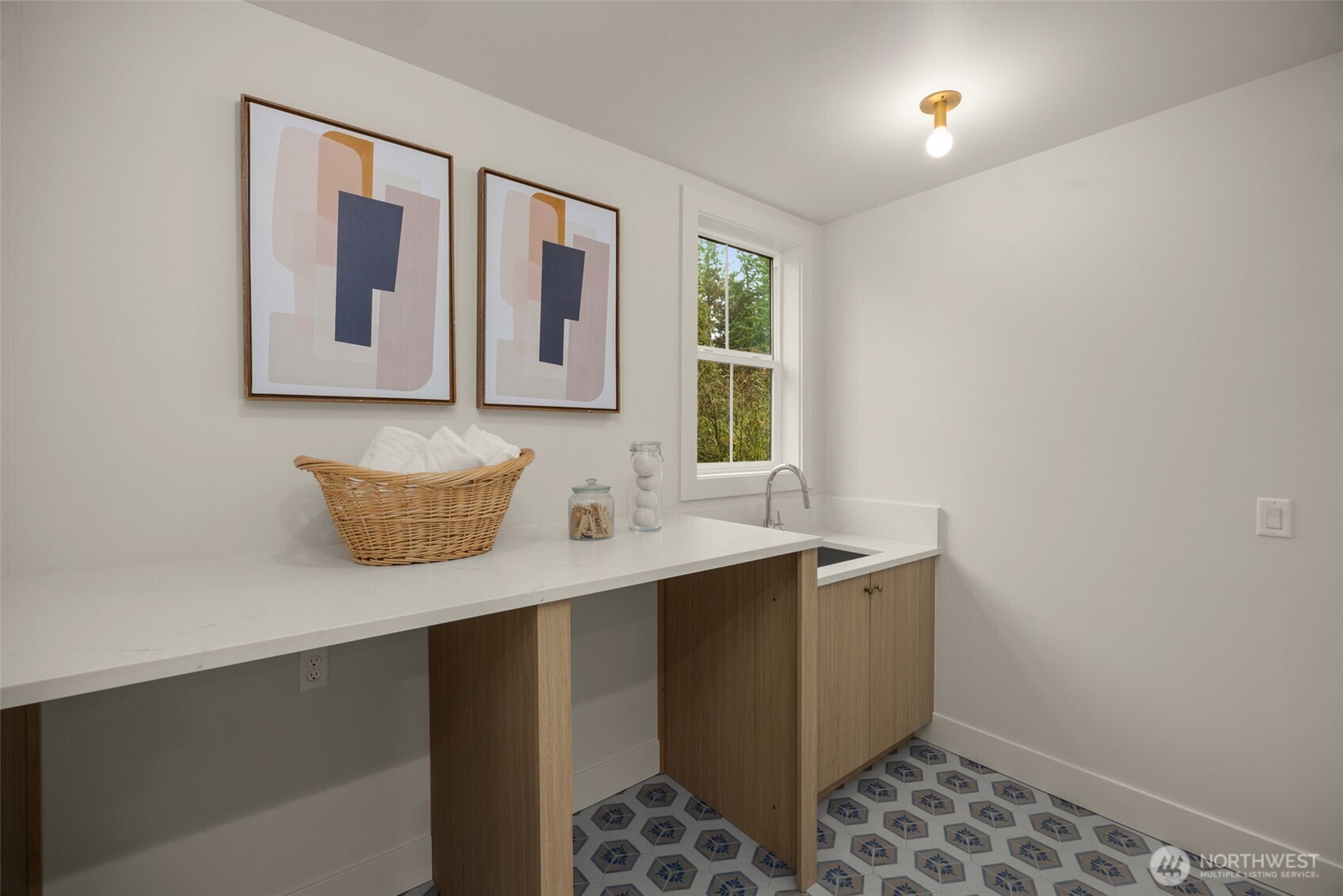 Upstairs laundry room with sink.