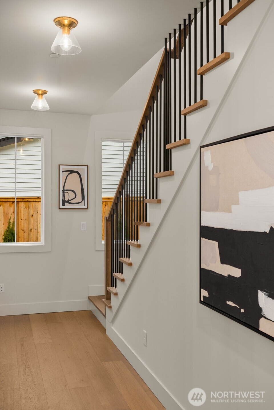 Entry hallway with staircase leading to upstairs bedrooms.