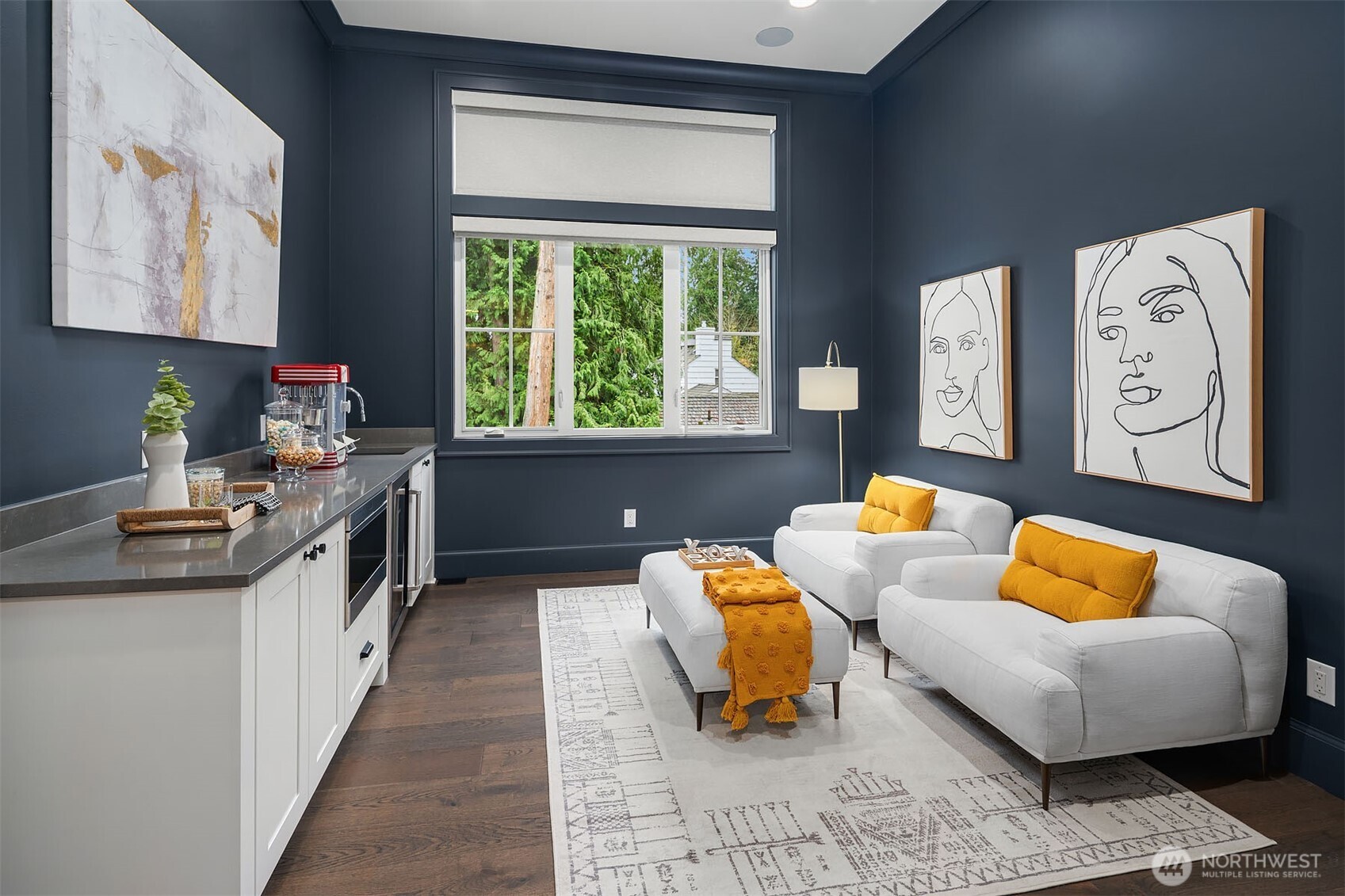 The second floor features a dedicated theater and entertainment room designed for comfort and convenience. This room is equipped with a built-in refrigerator and microwave, making it easy to enjoy refreshments and snacks without having to leave the area.