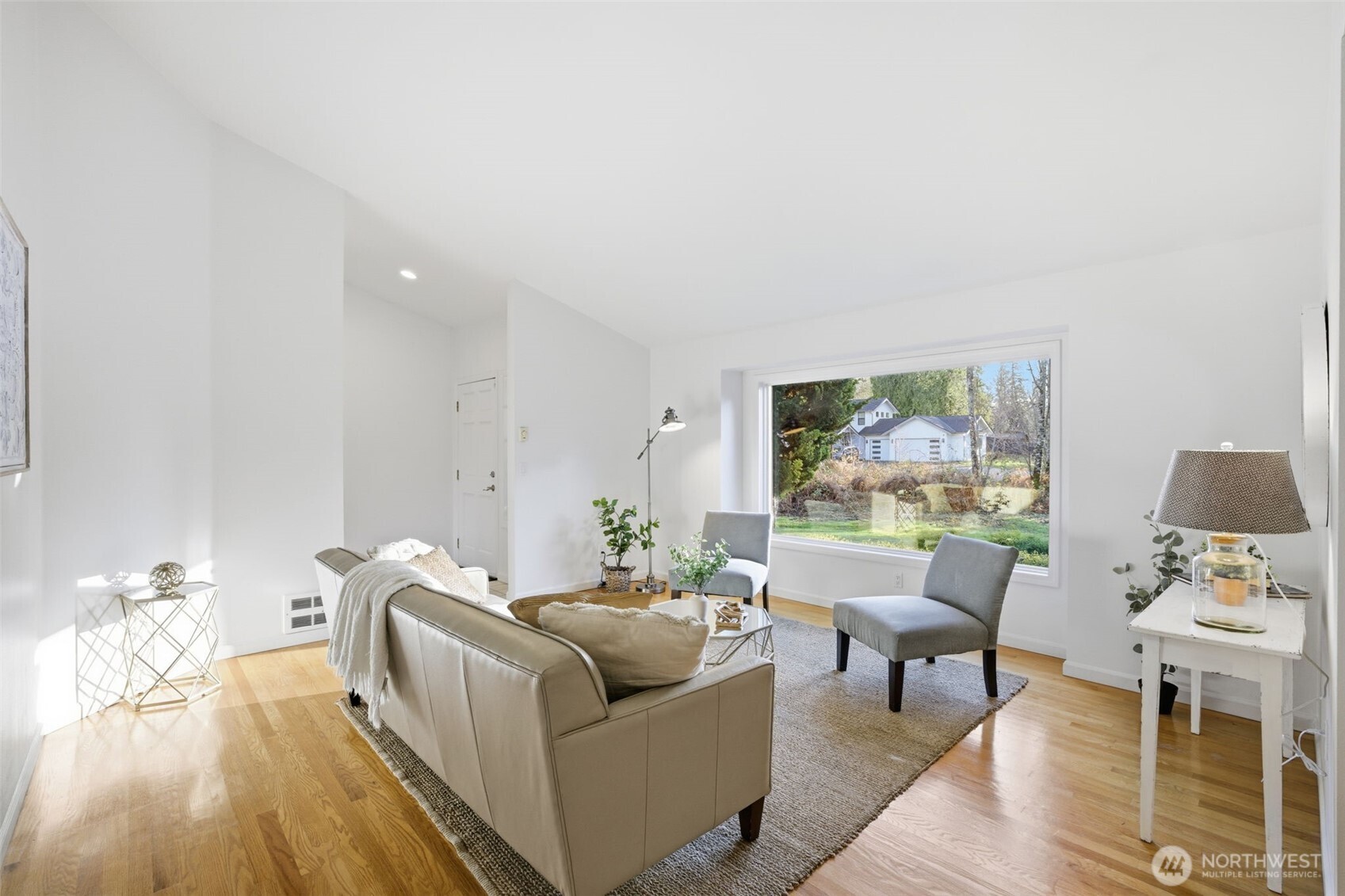 Light filled front room with oversized picture window!