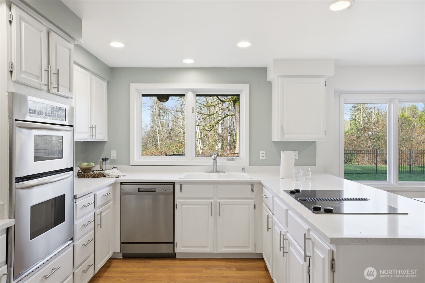 Light-filled kitchen with an open layout and quartz counters