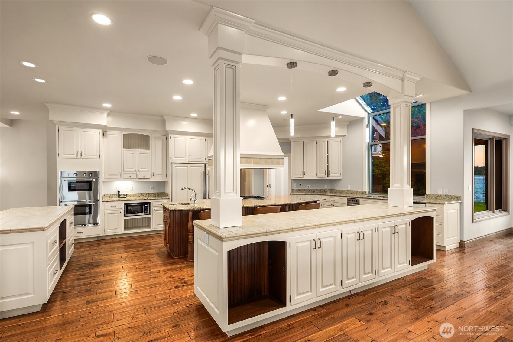 The kitchen also features Double whirlpool microwaves & sub-zero refrigerator and freezer.