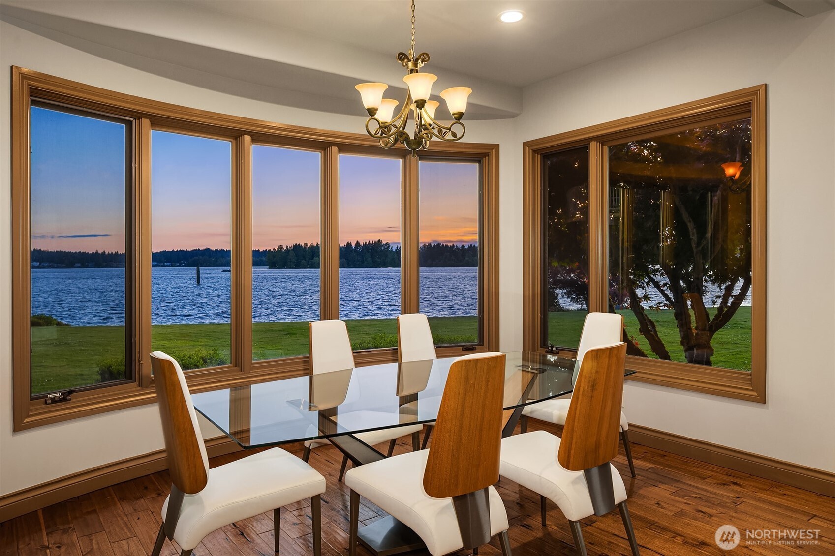 Secondary dining nook with chandelier off the great room easily serviced by the neighboring wet bar