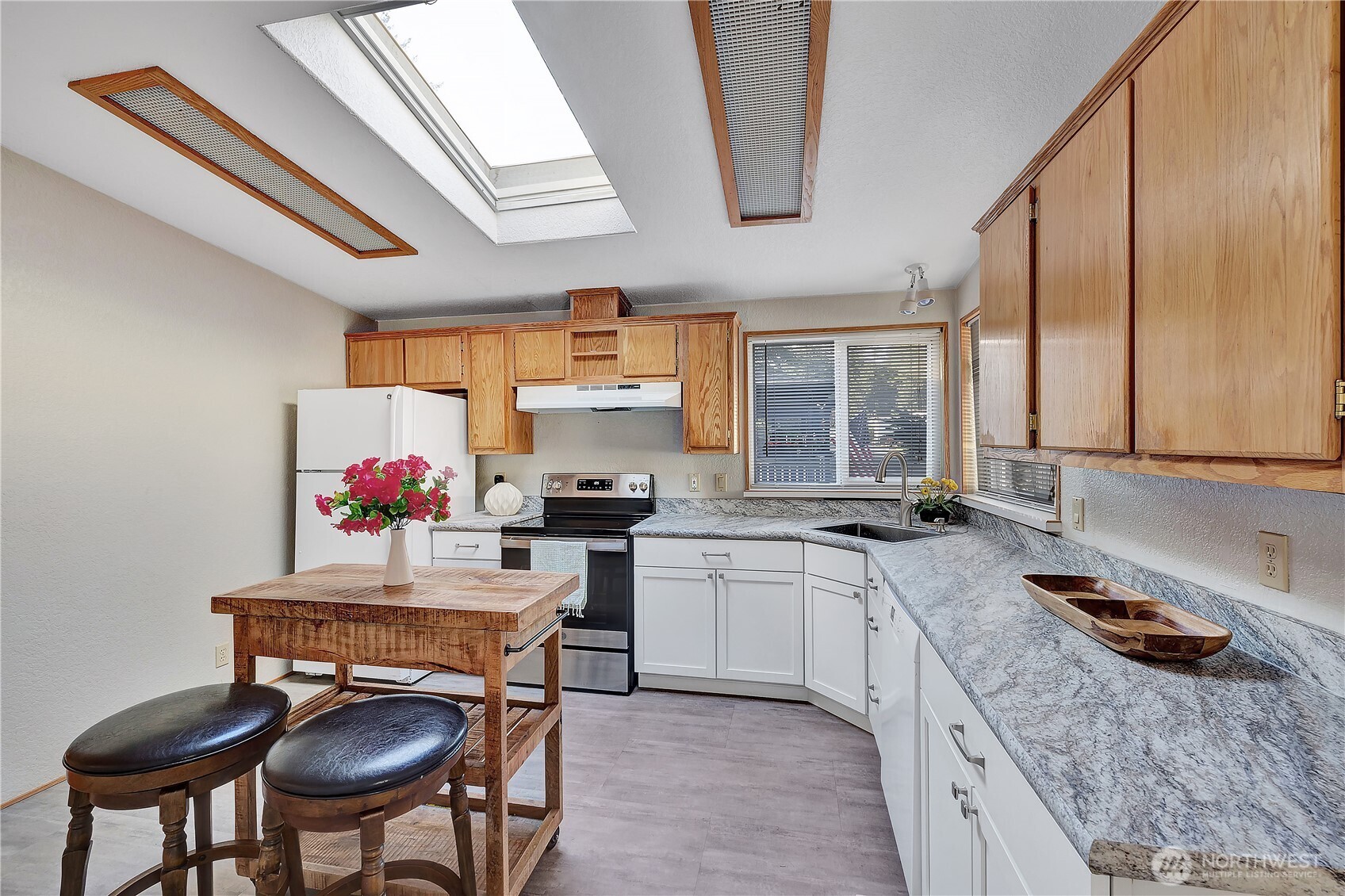 Another view of the kitchen. Plenty of room for a kitchen table or kitchen island.