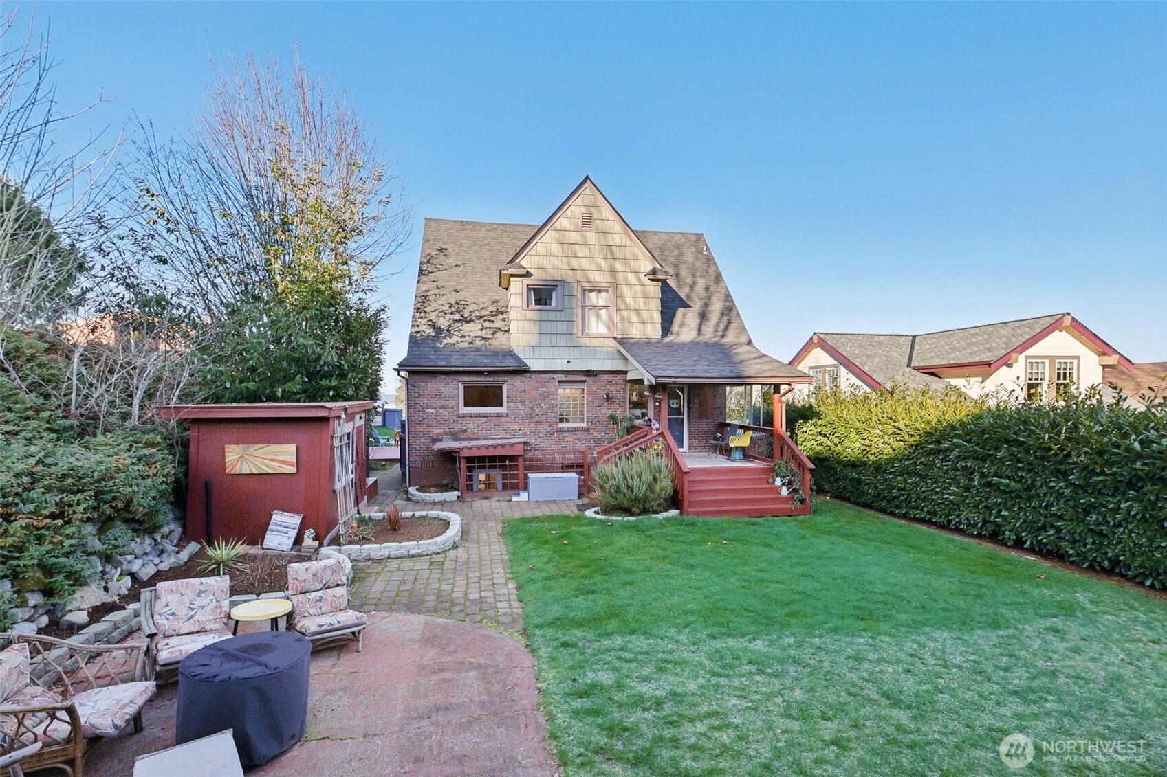 back of home with large fully fenced yard