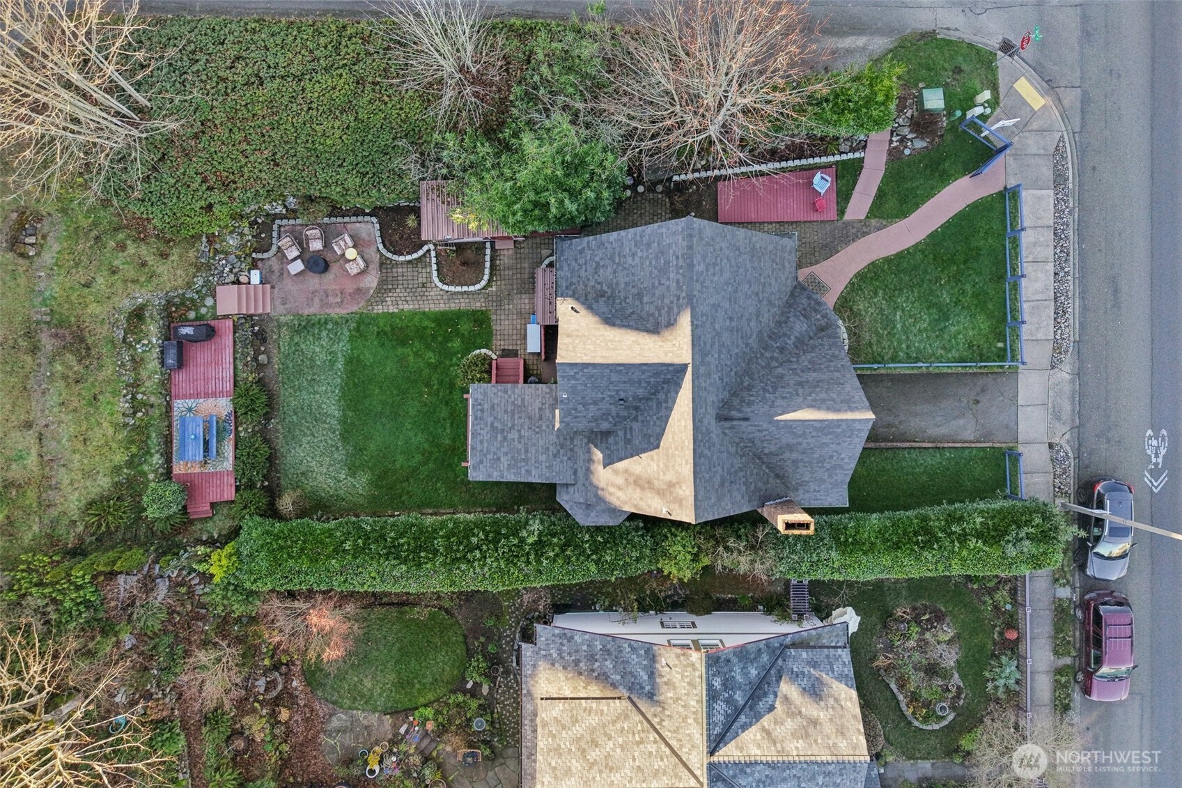 birds view of the newer roof and manicured yard