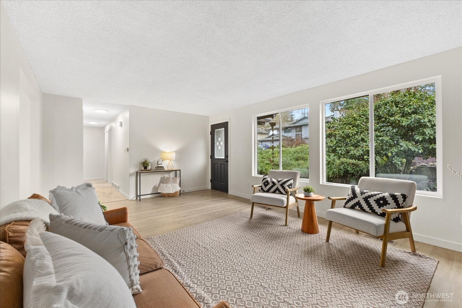 Light-filled home. Front door opens to living room.