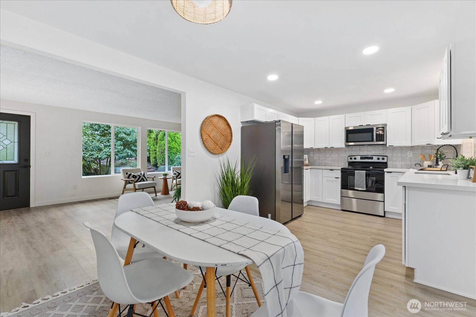 All new stainless steel appliances, quarts counters and tile backsplash.