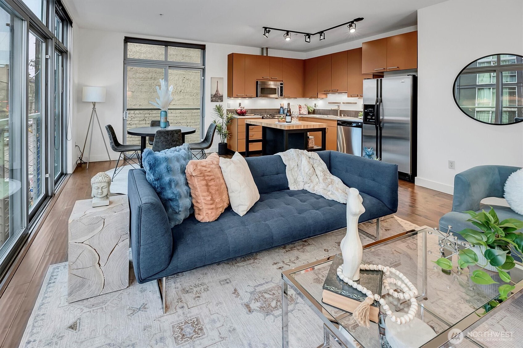 Sleek and modern living space. Open to kitchen and dining area