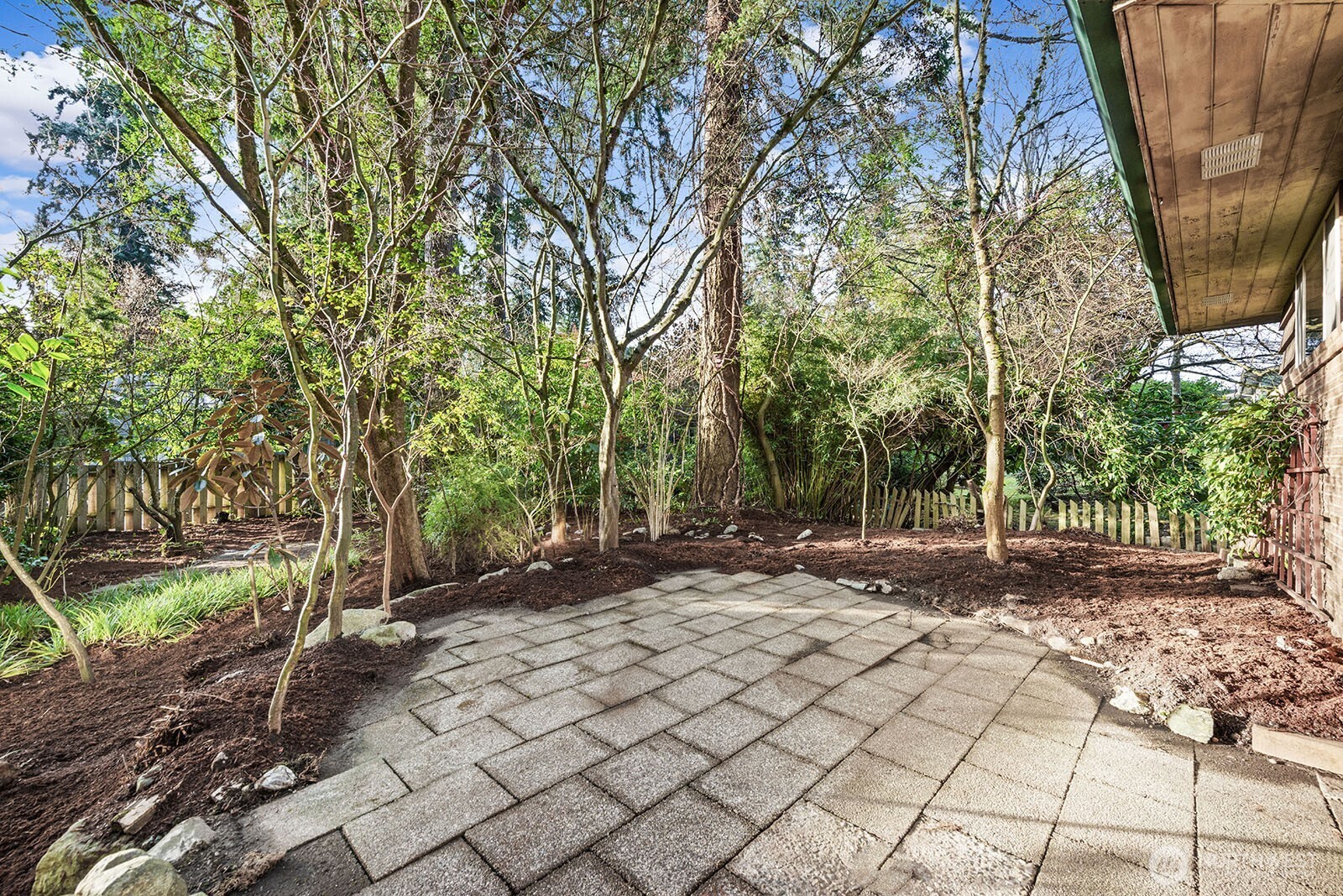 Pavers on the back patio make for a nice spot for dining al fresco.