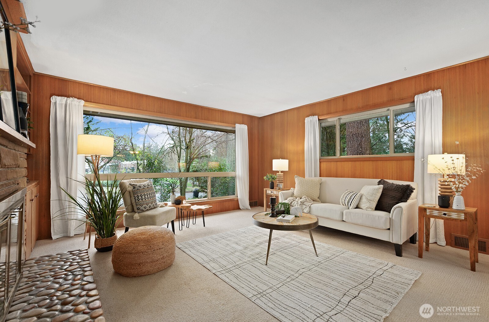 Living and dining rooms feature original mahogany paneling.