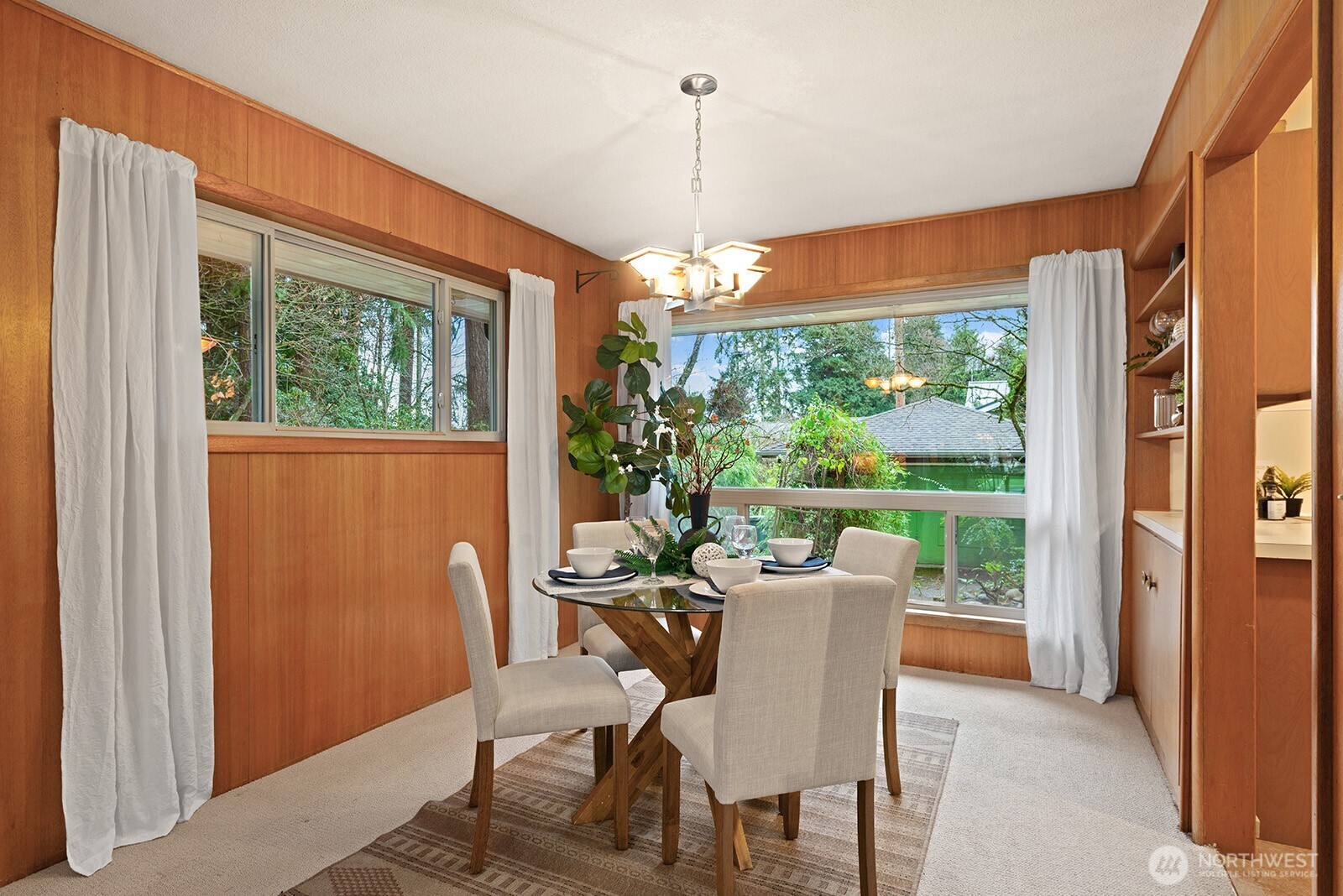 Enjoy peaceful morning coffee while looking out the large window overlooking the lush backyard.