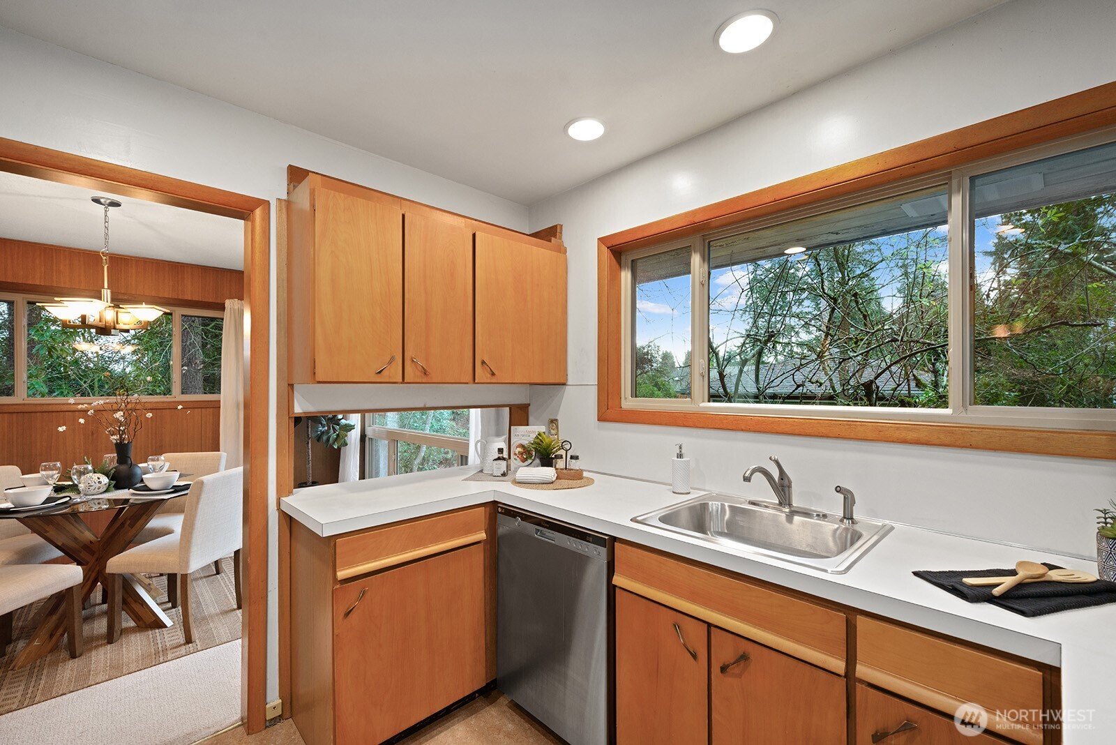 Expansive window above the sink offers beautiful backyard views.