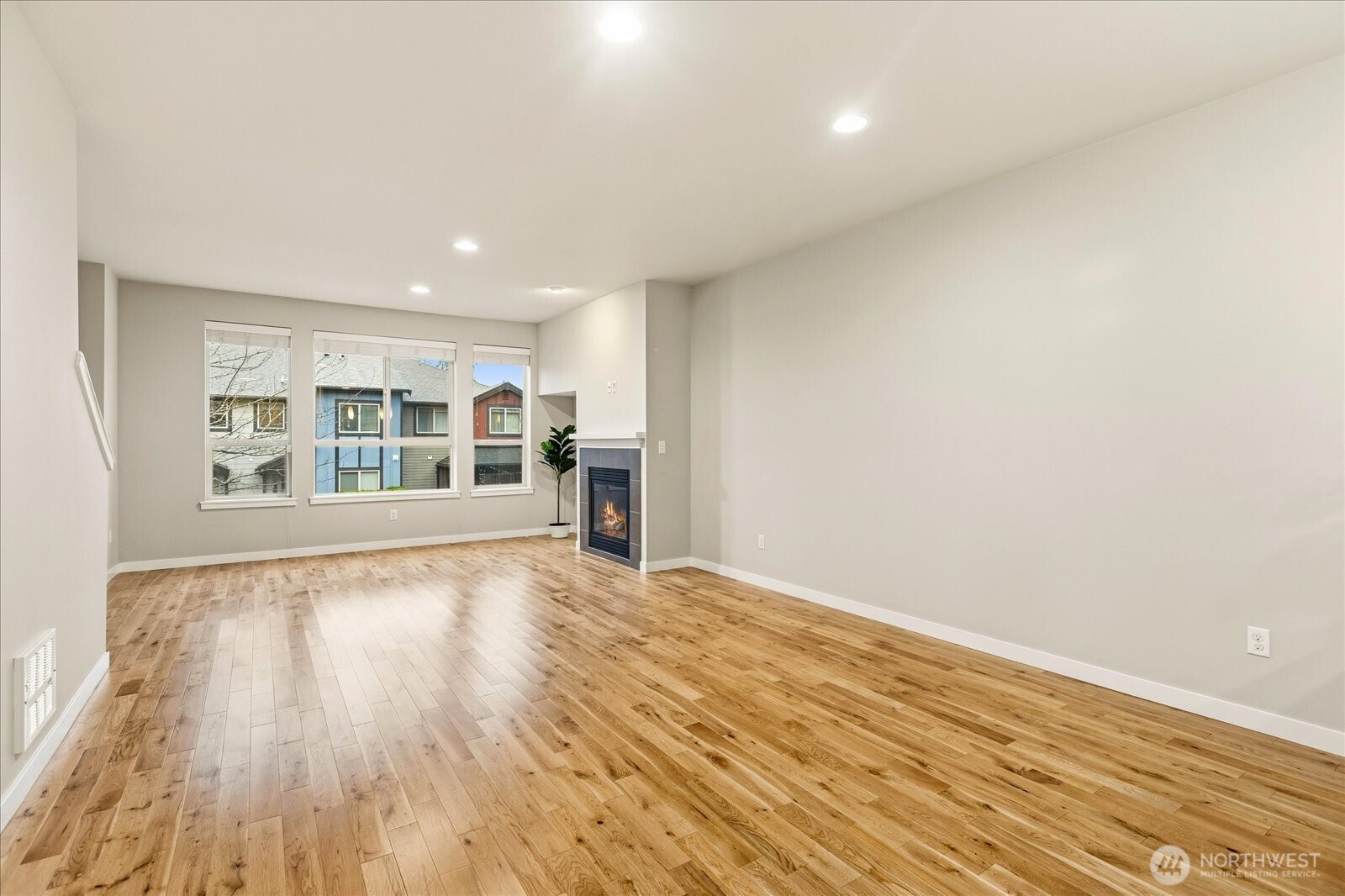 Great Room with gas fireplace and big windows for lots of daylight