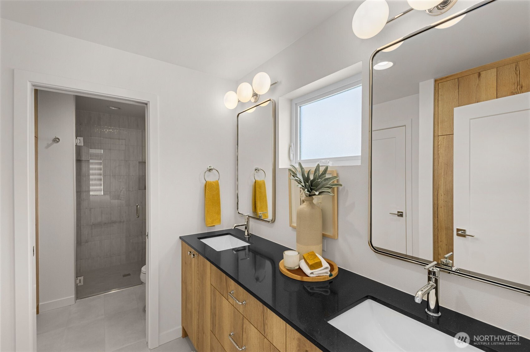 Flooded with natural light the primary bathroom combines crisp finishes with soft tones offering a serene start to each morning and a calming end to every day.