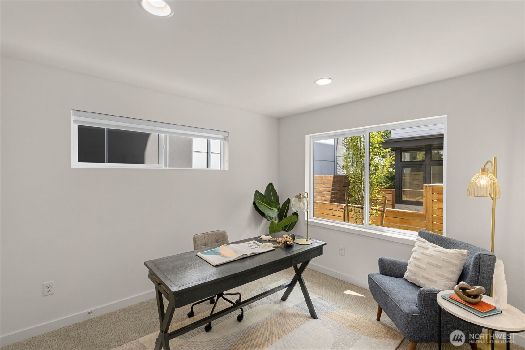 Additional bedroom offers natural light and comfort for guests or a quiet workspace.