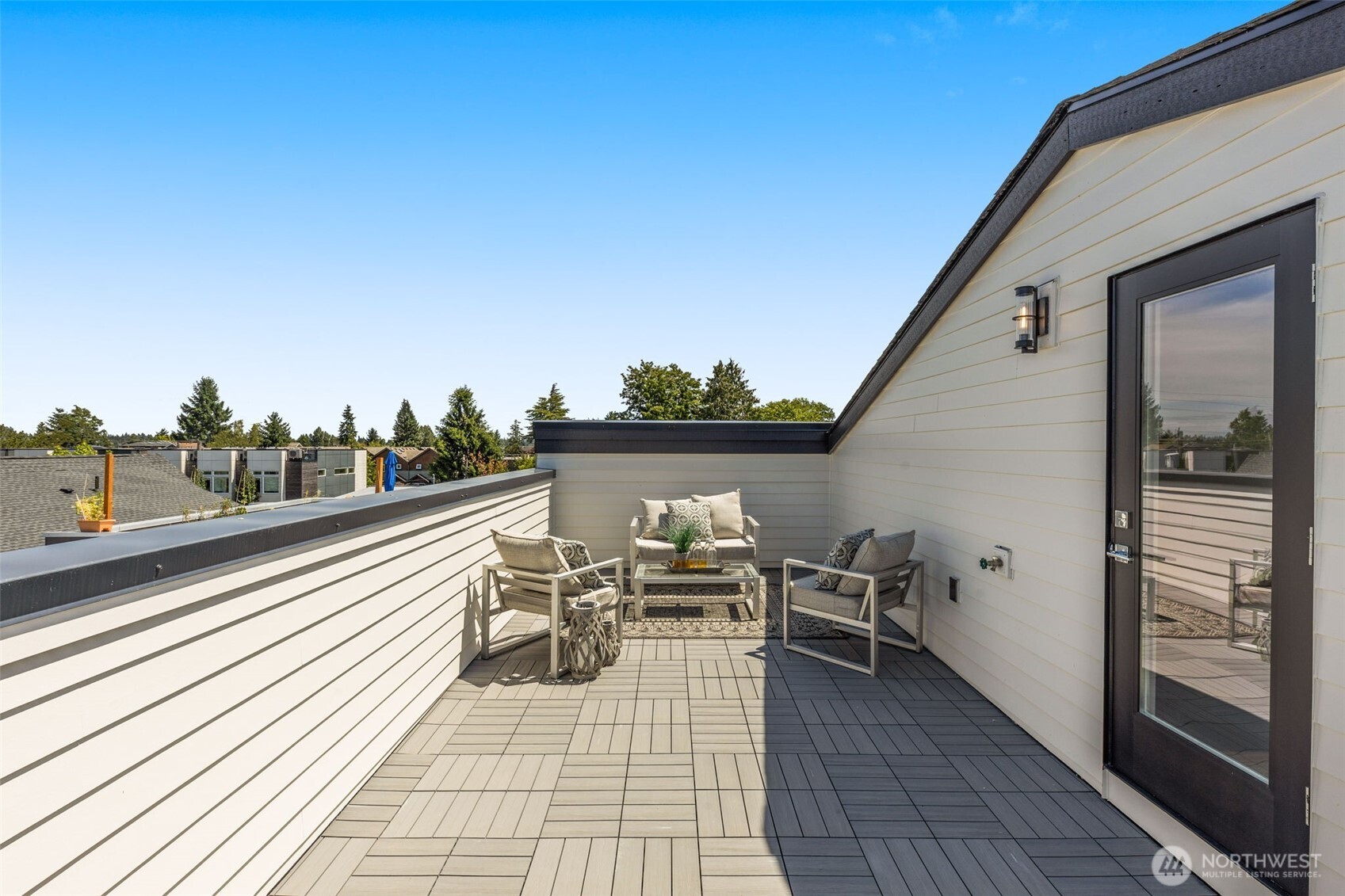 Private roof deck with gas hook-up water spigot and perimeter lighting extends your living outdoors.