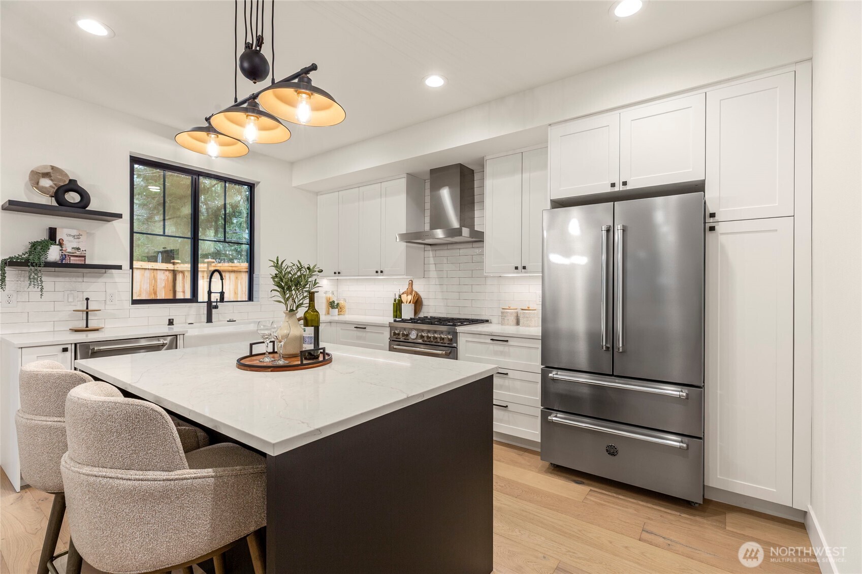 Bertazzoni refrigerator complimented by white kitchen cabinets