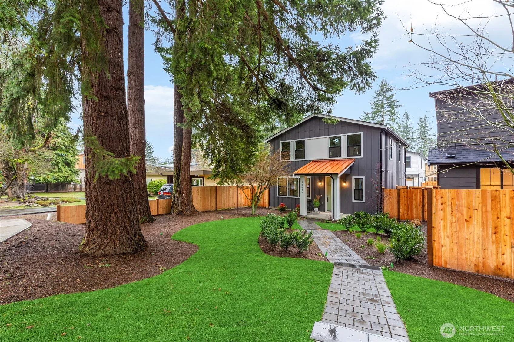 walkway with pavers leads to the front entry of the home.