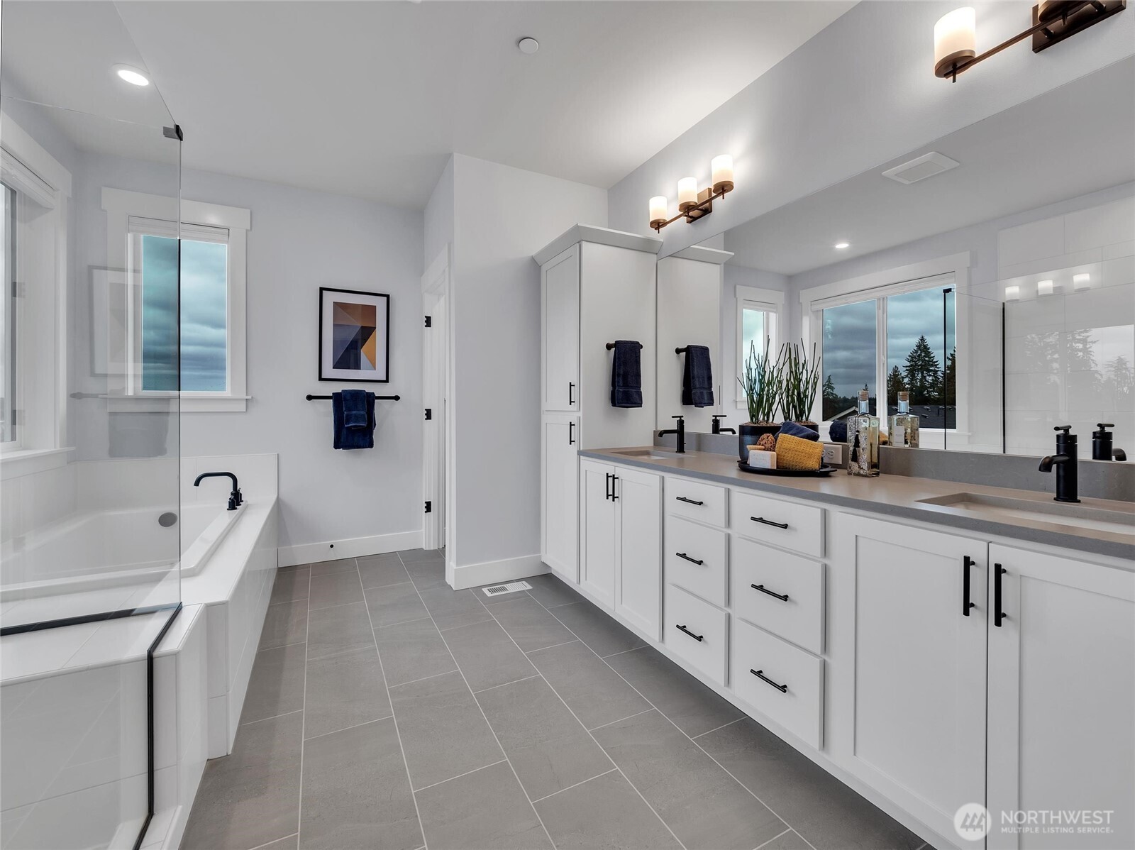 Primary features luxurious soaking tub and private toilet closet.  Photo is of model home-Victorian plan-elements of the Chateau plan can vary