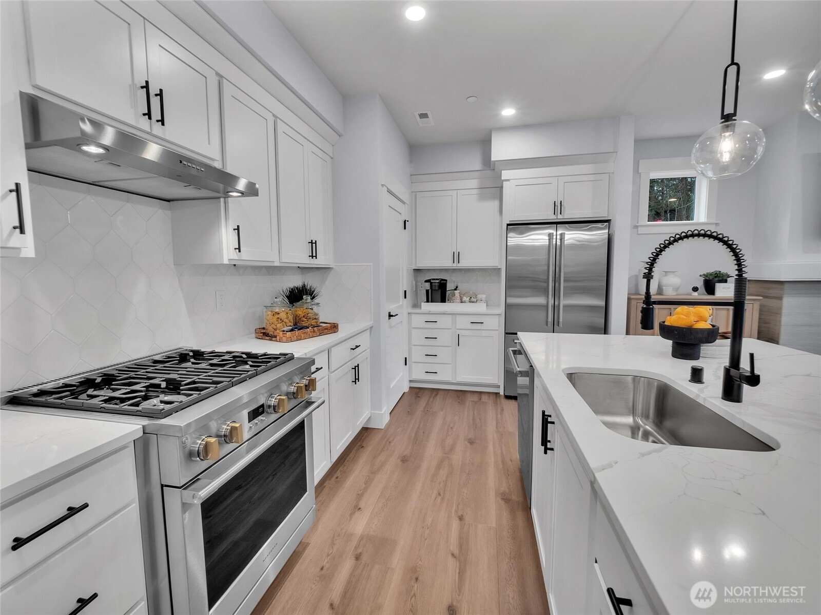 Dream kitchen boosts designated area for a coffee bar adjacent to the pantry. Photo is of model home-Victorian plan-elements of the Chateau plan can vary