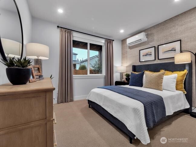 Guests can have a private escape in the lower level bedroom. Photo is of model home-Victorian plan-elements of the Chateau plan can vary