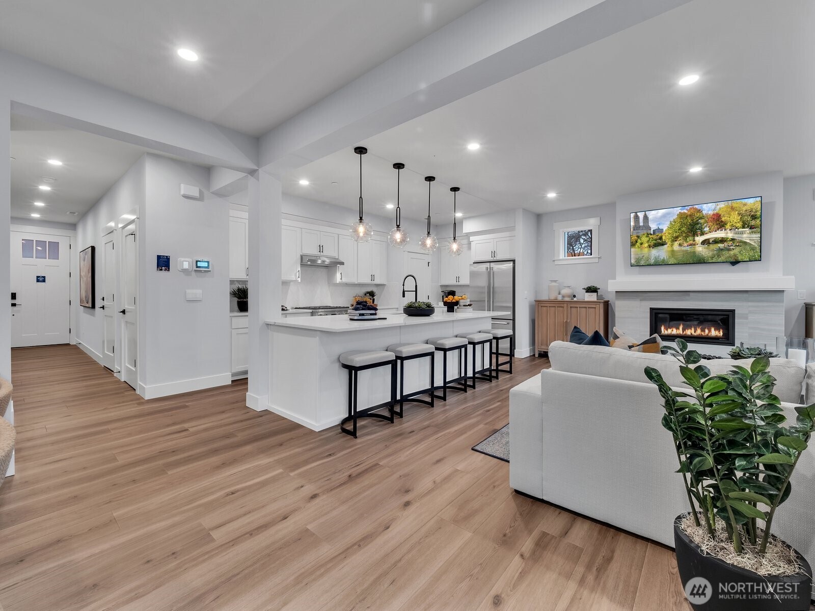 Dining room overlooks great room and kitchen perfect for entertaining. Photo is of model home-Victorian plan-elements of the Chateau plan can vary