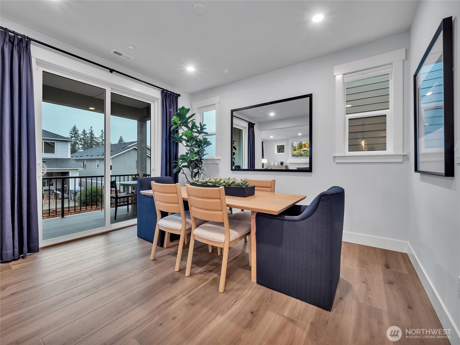 Dining room connects to covered deck providing multi entertaining options- Photo is of model home-Victorian plan-elements of Chateau plan can vary