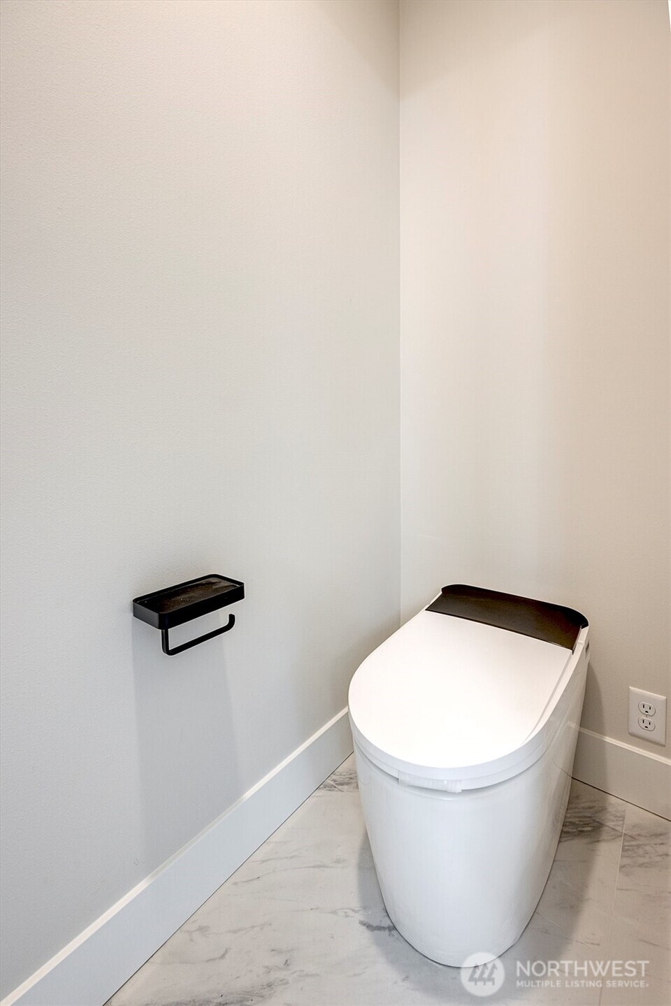 Smart toilet in primary bath with bidet and heated seat