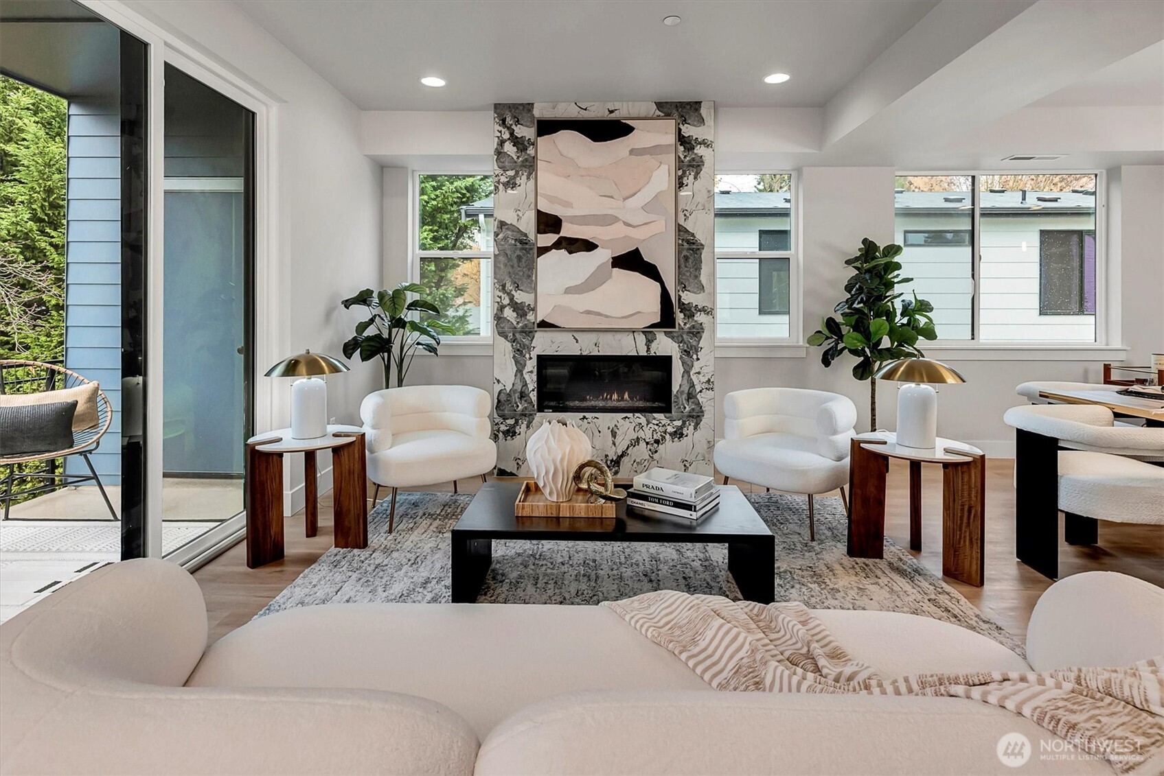Statement fireplace is the focal point of this living area