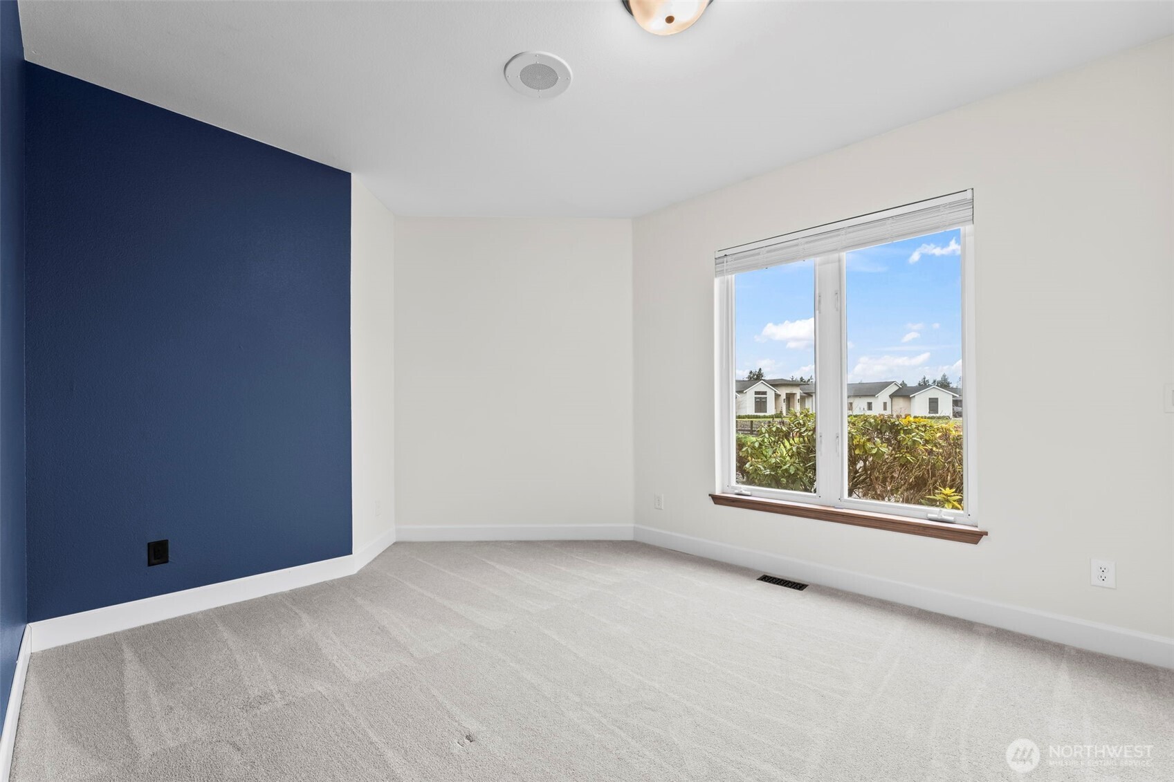 The second of the bedrooms with accent wall in the popular Benjamin Moore color, Hale Navy