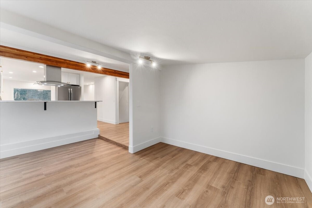 Designed to feel both defined and open, the kitchen connects seamlessly to the surrounding living spaces, creating a warm and welcoming atmosphere perfect for gathering.