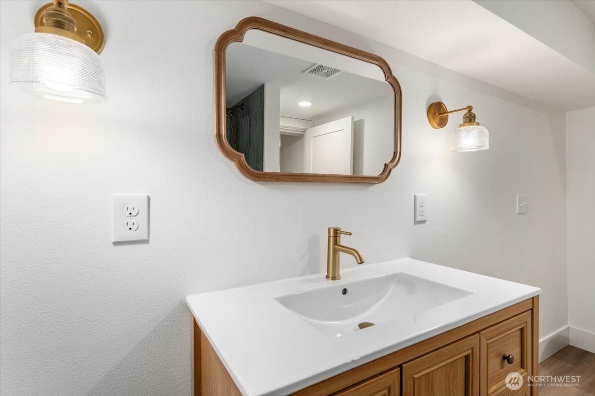 The upstairs loft has been fully updated and features fresh carpet, making it a versatile space perfect for an additional bedroom, recreational area, or whatever suits your needs.