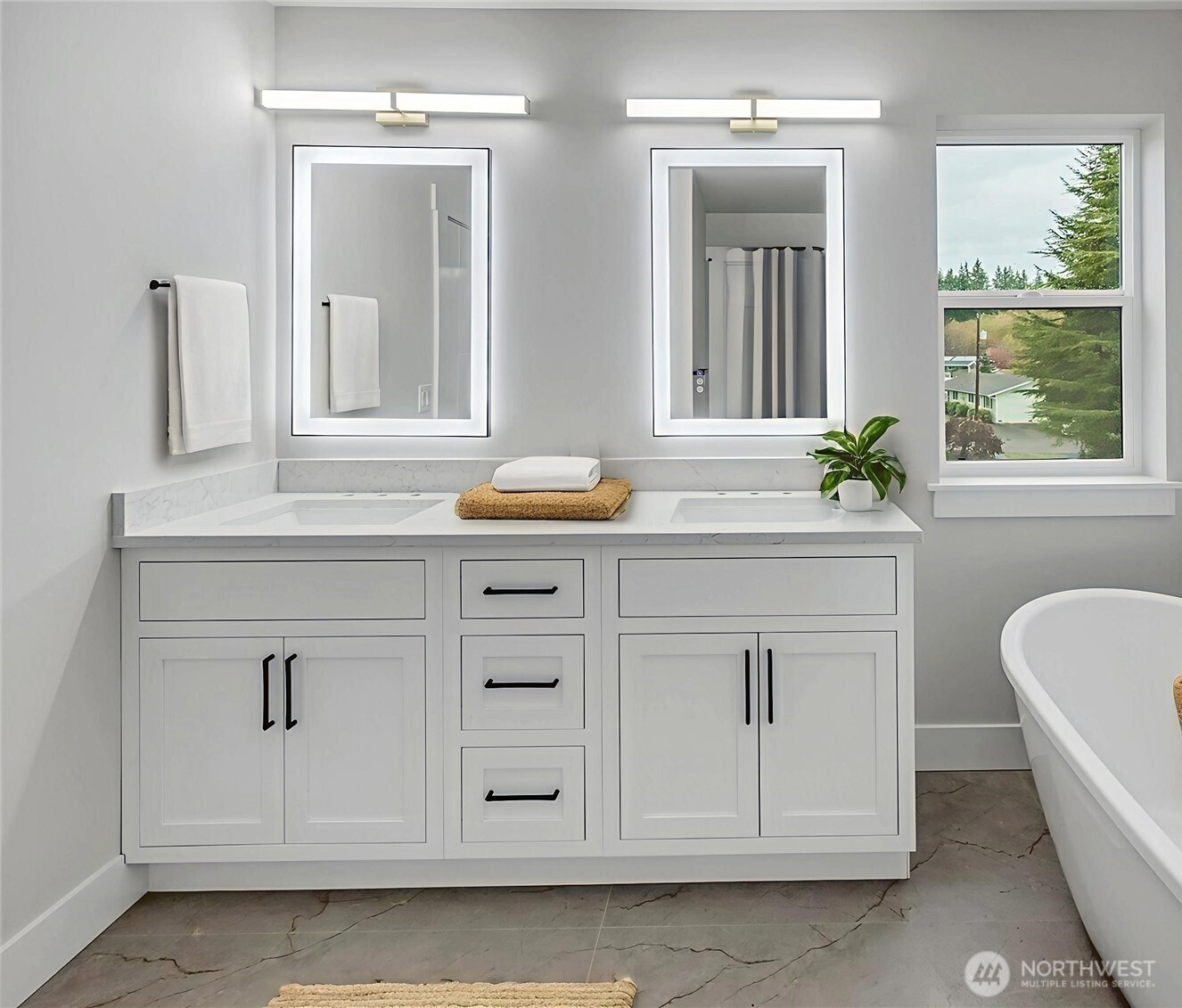 Primary bathroom has double vanity, soaking tub, ceramic tiled shower, and smart toilet. Virtually staged