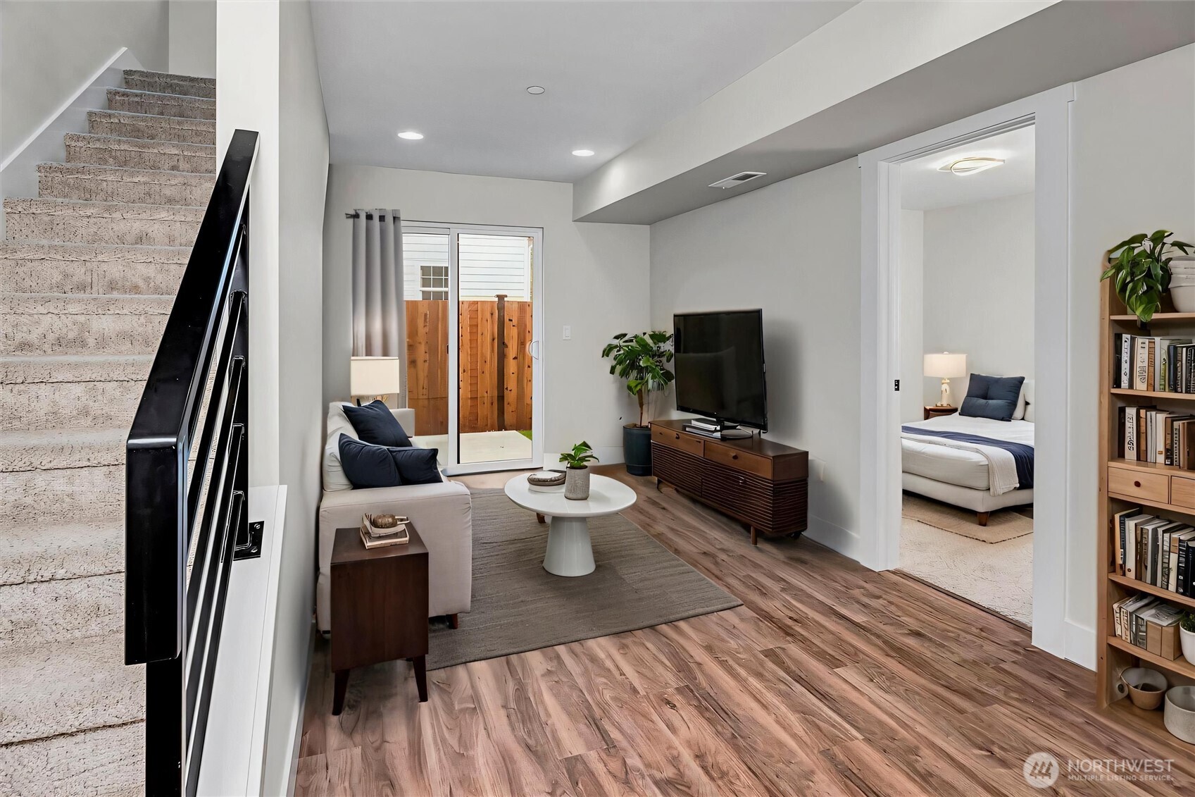 Entry floor has living area as well as bedroom and bathroom. Virtually staged.