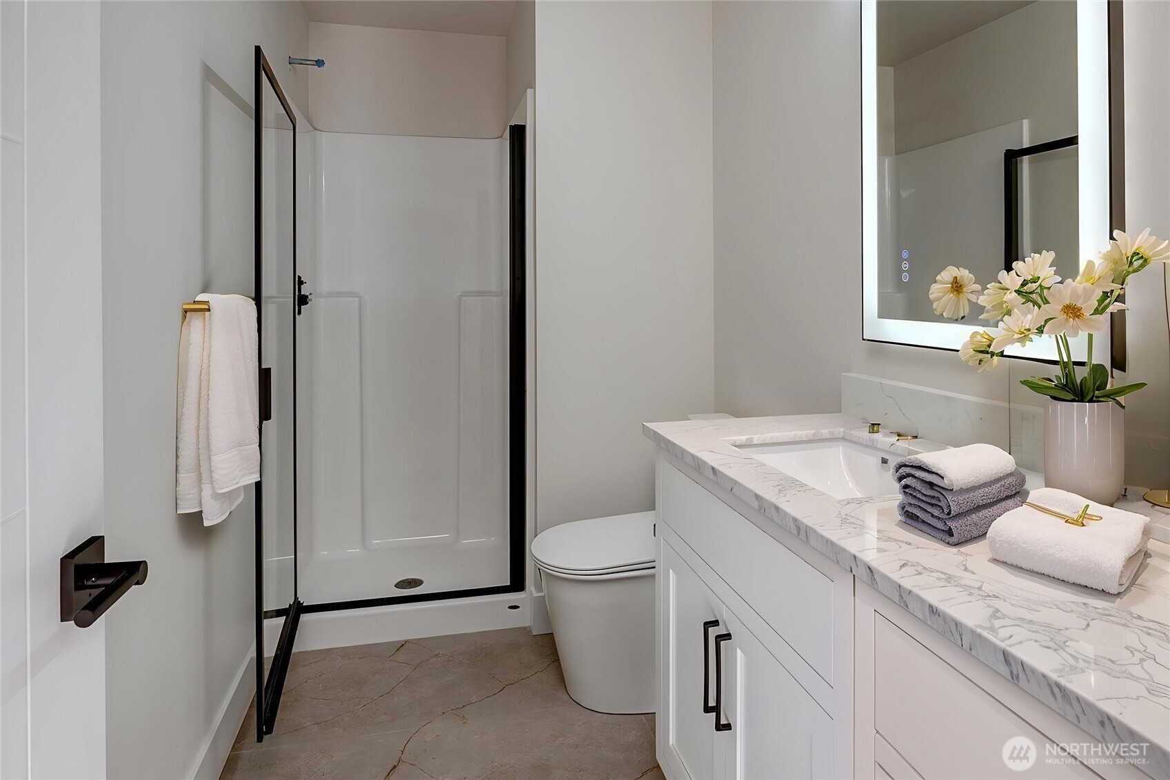 Bathroom on entry floor is accessible from living area or bedroom. Virtually staged.