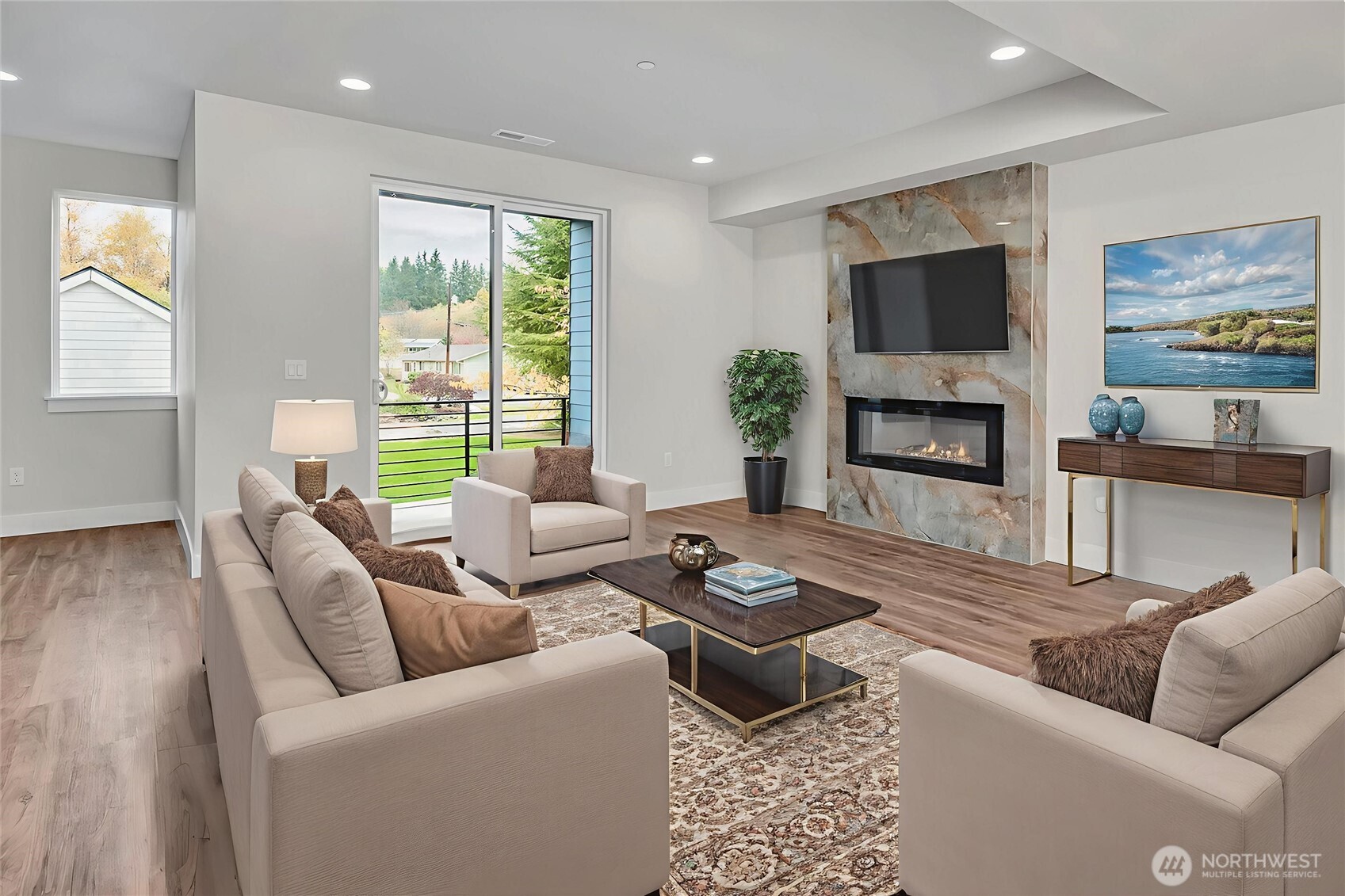 Large living space on main level with access to covered deck. Virtually staged.