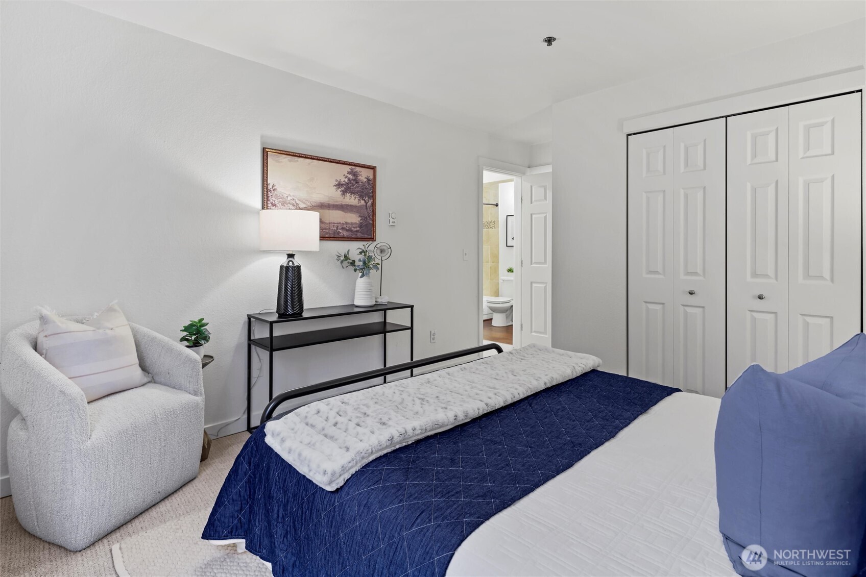 Primary ensuite with large vanity and full bath.