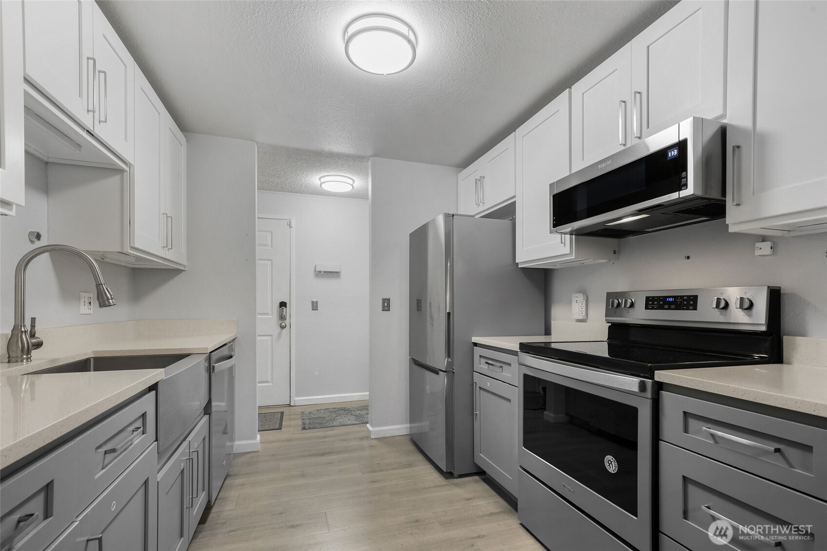 A view from the galley kitchen towards the front door.