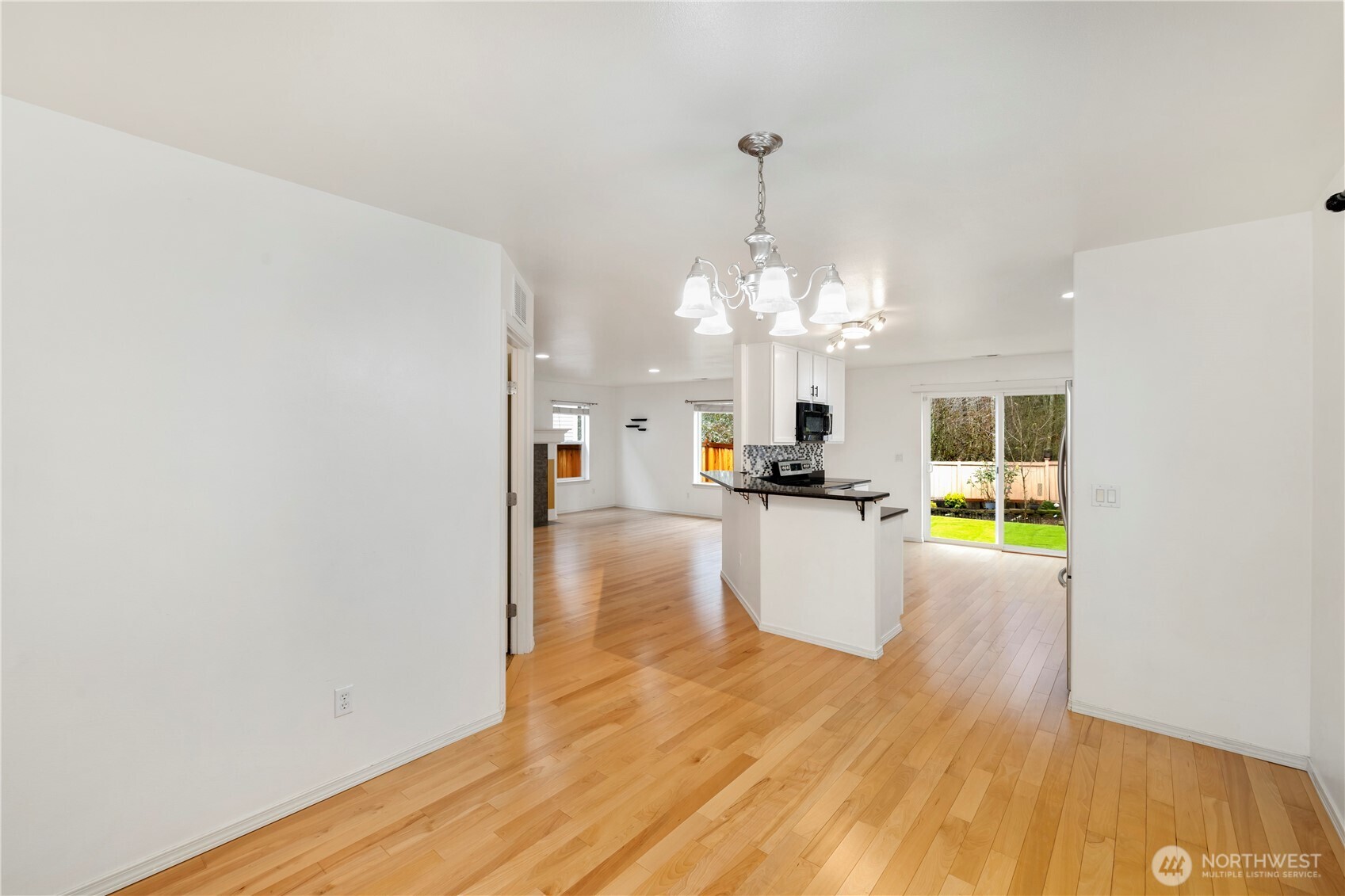 Formal dining room that is large enough for a full dining set. Perfect for gatherings.