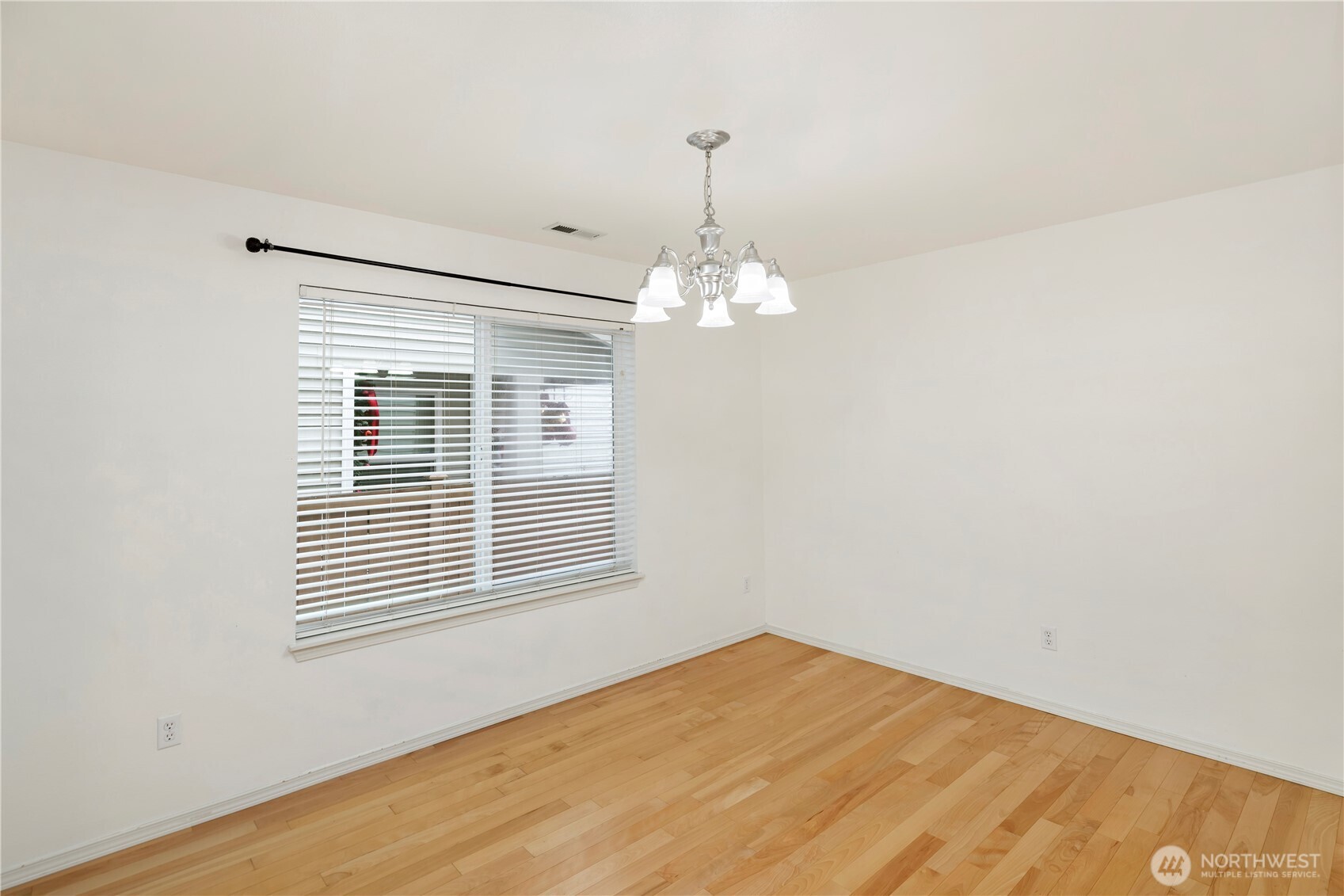 Another angle of the dining room showing light streams through these 2 windows.