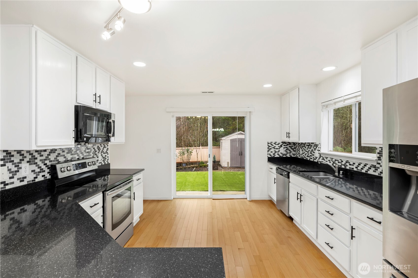 Easy to entertain from this kitchen, then via sliding door to the patio and backyard.