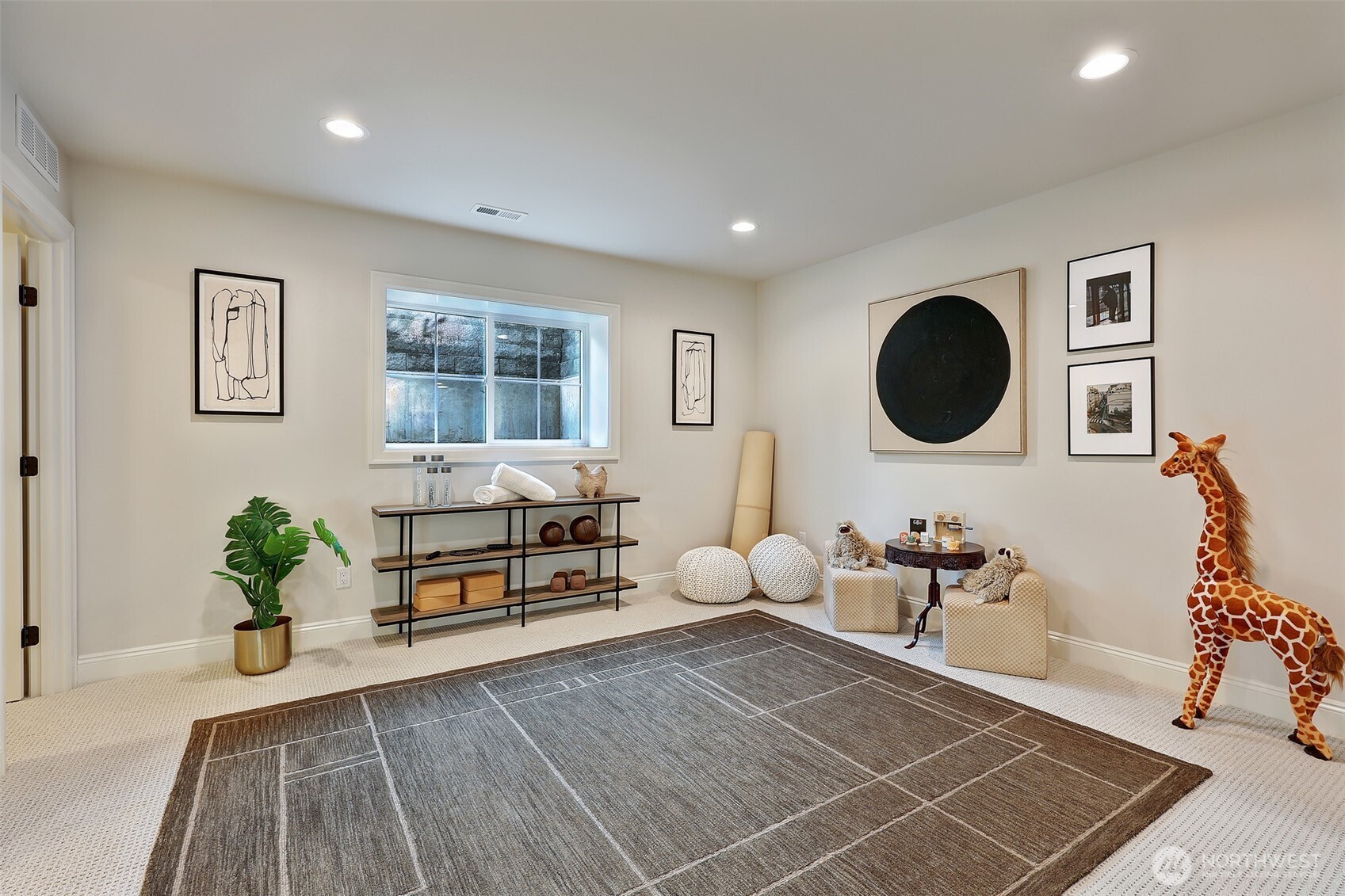 5th bedroom (makes a great home gym, guest room, etc) on lower level includes HUGE closets for all your extra storage needs (2 closets to left of photo).