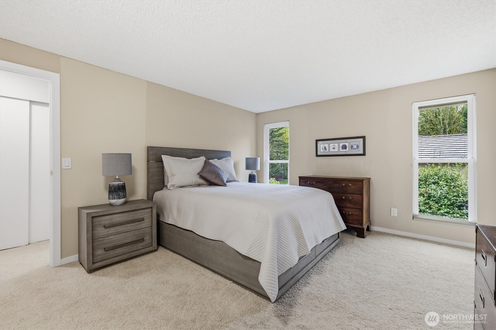The primary suite has great size and can accommodate large bedroom furniture. You will love this room's privacy.