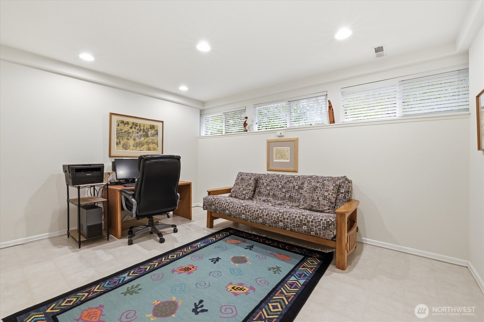 Here you see the fabulous downstairs home office.  This room can accommodate your home office and it also qualifies as a fifth bedroom.  This would be an ideal spot for a live-in family member as the downstairs bathroom has a shower.