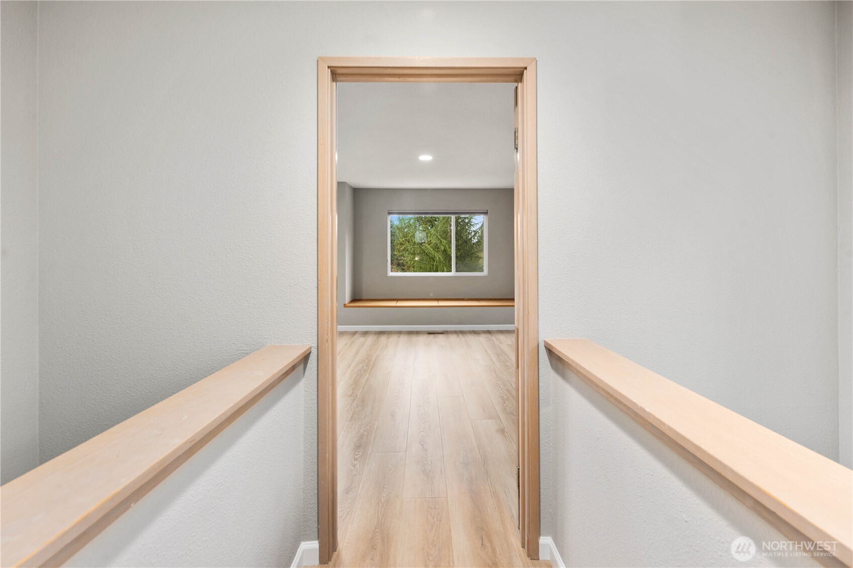 Spacious main-level living area with spectacular new floors, recessed lighting, cozy gas fireplace, display niches, and versatile layout for entertaining. Adjoining open formal dining space means everyone can be together.